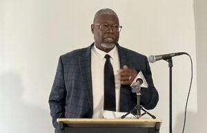 MLK Center leader Sherrod passes James Sherrod, member of the Minority Community Investment Coalition, at the announcement of Grow Erie, Nov. 21, 2025. Photo by Joel Natalie, TalkErie.com.